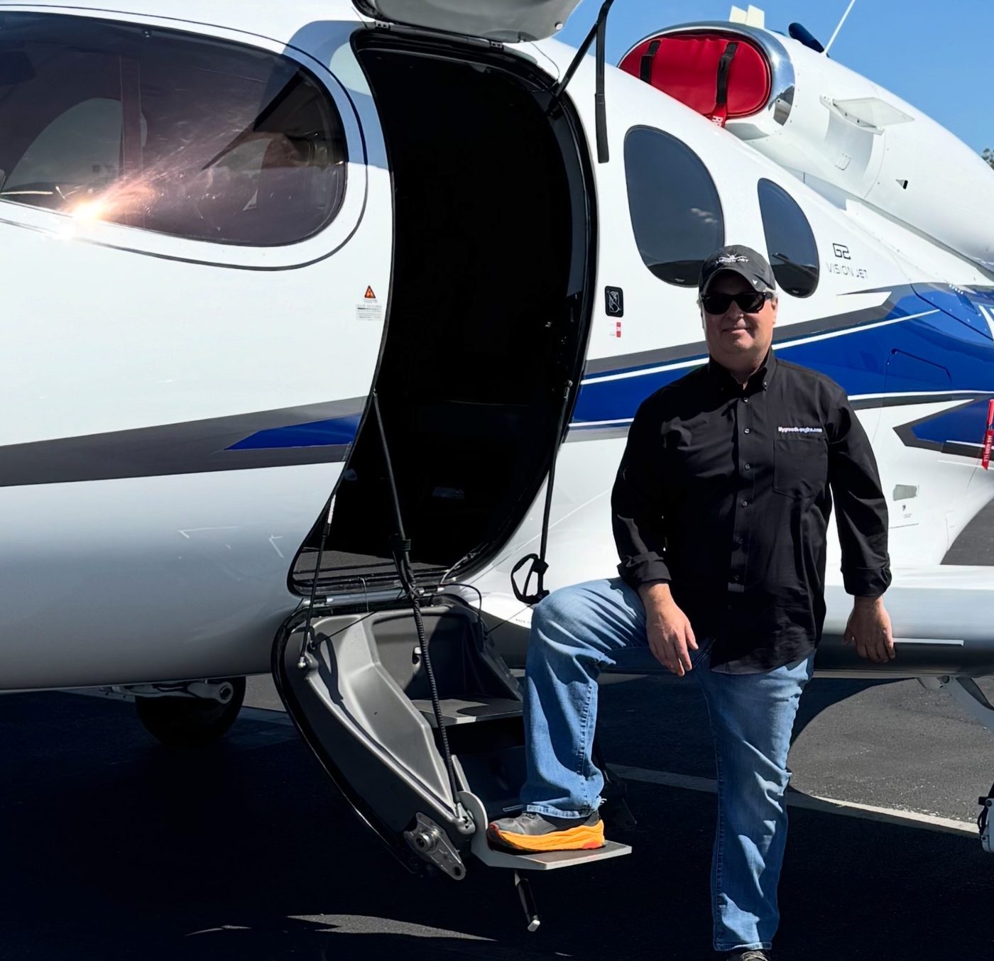 Jay Hirshberg on the step of his Cirrus Vision Jet